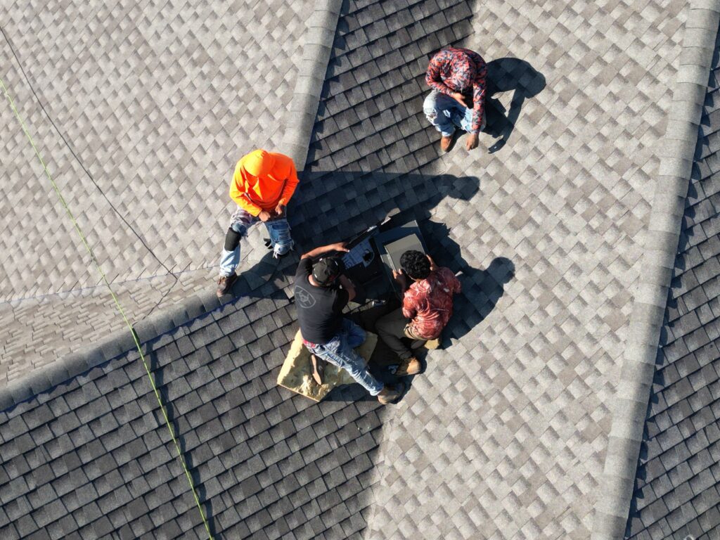 24/7 emergency roof repair technician fixing storm-damaged roof in Frisco TX